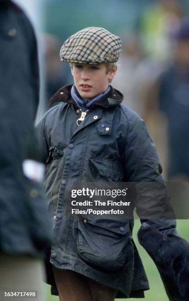 Peter Phillips, the son of HRH Princess Anne and her first husband Captain Mark Phillips , with a black labrador, attending the Royal Windsor Horse...