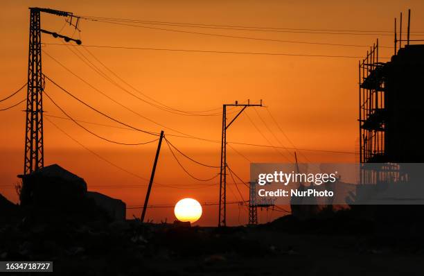 Picture taken from Beit Lahiya shows the sunset northern Gaza Strip on August 30, 2023.