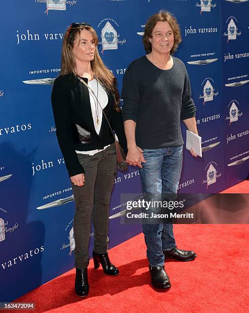 Janie Liszewski and guitarist Eddie Van Halen attend the John Varvatos 10th Annual Stuart House Benefit presented by Chrysler, Kids Tent by Hasbro...