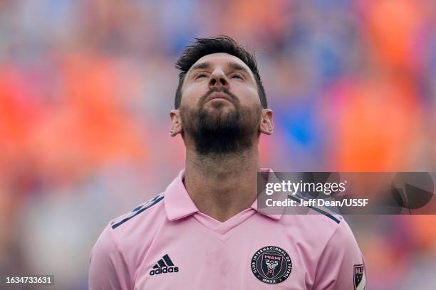 Lionel Messi of Inter Miami stands during the national anthem prior to a U.S. Open Cup semifinal match against FC Cincinnati at TQL Stadium on August...