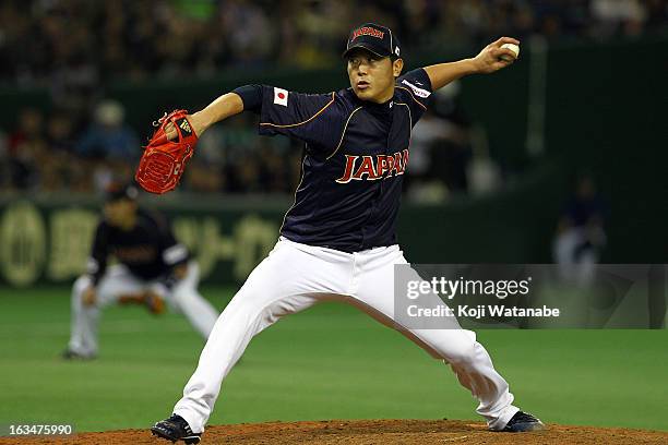 Tetsuya Utsumi of Japan pitches during the World Baseball Classic Second Round Pool 1 game between Japan and the Netherlands at Tokyo Dome on March...