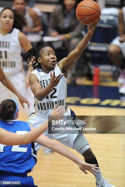 Danni Jackson of the George Washington Colonials drives to the basket during a women's college basketball game against the Saint Louis Billikens on...