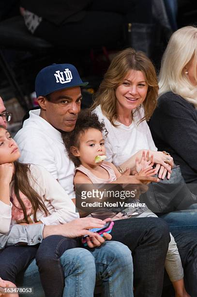 Chris Ivery, his daughter Stella Luna Ivery and wife Ellen Pompeo attend a basketball game between the Chicago Bulls and Los Angeles Lakers at...