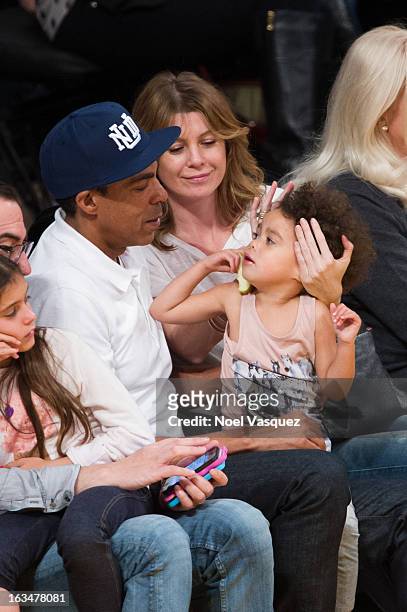 Chris Ivery, Ellen Pompeo and their daughter Stella Luna Ivery attend a basketball game between the Chicago Bulls and Los Angeles Lakers at Staples...