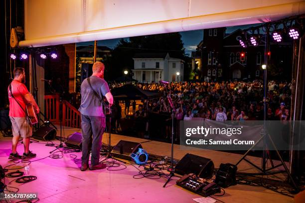 Christopher Anthony Lunsford, who goes by the stage name Oliver Anthony, gives a surprise performance with guitarist Joey Davis at the Rock the Block...