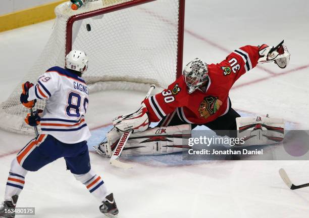 Sam Gagner of the Edmonton Oilers scores a 1st period goal against Ray Emery of the Chicago Blackhawks at the United Center on March 10, 2013 in...