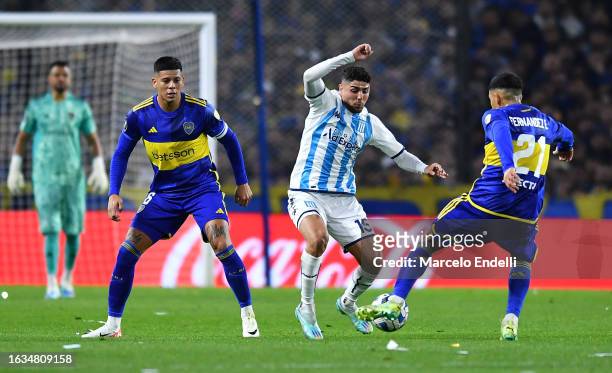 Maxi Romero of Racing Club battled for the ball with Marcos Rojo and Ezequiel Fernández of Boca Juniors during the Copa CONMEBOL Libertadores 2023...