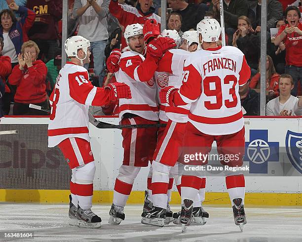 Jakub Kindl of the Detroit Red Wings celebrates his goal with Pavel Datsyuk, Johan Franzen, Justin Abdelkader and Ian White during an NHL game...