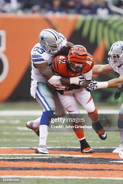 Anthony Spencer of the Dallas Cowboys makes the tackle during the game against the Cincinnati Bengals at Paul Brown Stadium on December 9, 2012 in...