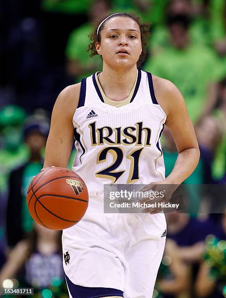 Kayla McBride of the Notre Dame Fighting Irish dribbles the ball up court during the game against the Connecticut Huskies at Purcel Pavilion on March...