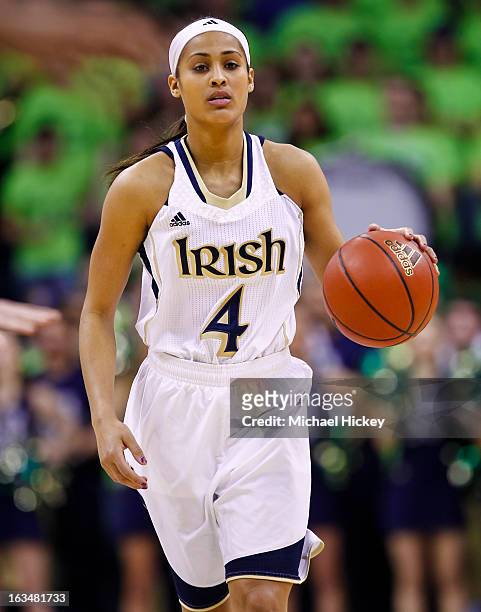 Skylar Diggins of the Notre Dame Fighting Irish dribbles the ball up court against the Connecticut Huskies at Purcel Pavilion on March 4, 2013 in...