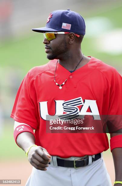 Brandon Phillips of Team USA returns to the dugout during a game against the Chicago White Sox during a WBC exhibition game at Camelback Ranch on...