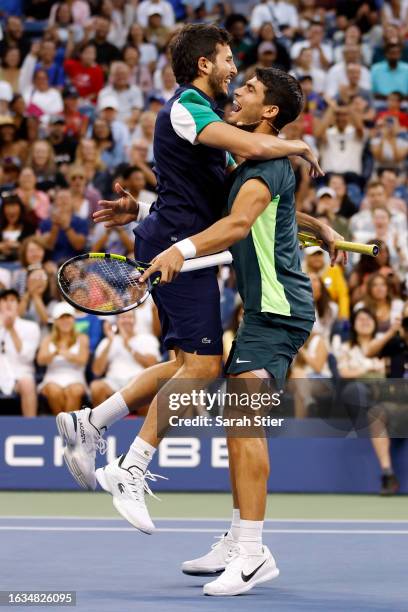 Singer Sebastián Yatra of Colombia reacts with Carlos Alcaraz of Spain react after a point during the Stars of the Open Exhibition Match to Benefit...