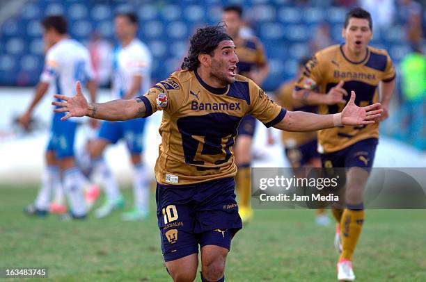 Martin Bravo of Pumas celebrates a goal against Puebla during a match between Puebla and Pumas as part of the Clausura 2013 Liga MX at Cuauhtemoc...