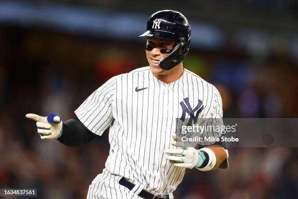 Aaron Judge of the New York Yankees points to the dugout after hitting his third home run of the game against the Washington Nationals at Yankee...