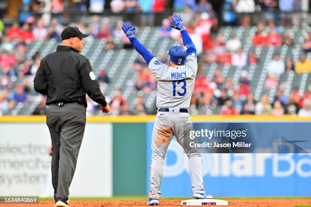 Max Muncy of the Los Angeles Dodgers celebrates after hitting a double during the first inning against the Cleveland Guardians at Progressive Field...