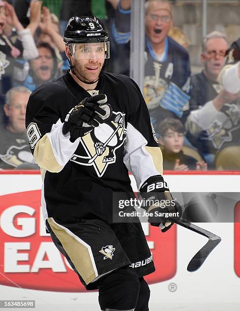 Pascal Dupuis of the Pittsburgh Penguins celebrates his second goal of the game during the third period against the New York Islanders on March 10,...