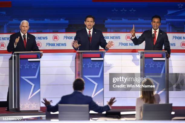 Republican presidential candidates , former U.S. Vice President Mike Pence, Florida Gov. Ron DeSantis and Vivek Ramaswamy participate in the first...