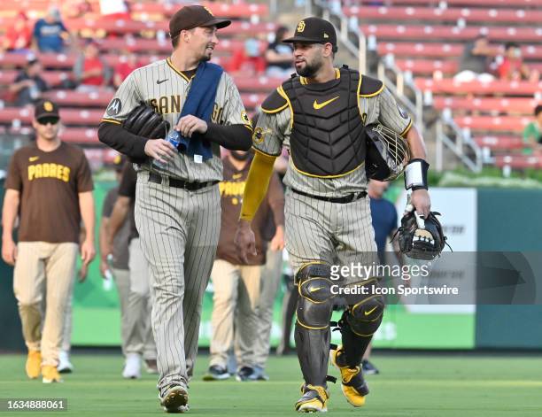 San Diego Padres starting pitcher Blake Snell and San Diego Padres catcher Gary Sanchez walk to the dugout after warming up before a MLB game between...