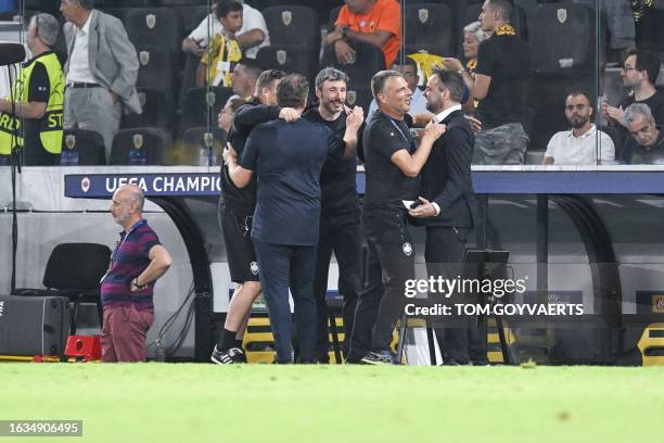 Antwerp's head coach Mark van Bommel celebrates after winning a soccer game between Greek AEK Athens FC and Belgian soccer team Royal Antwerp FC,...