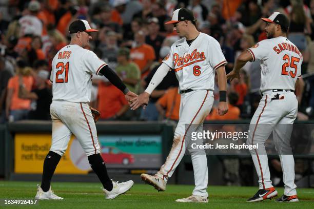 Austin Hays of the Baltimore Orioles celebrates with Ryan Mountcastle and Anthony Santander after winning against the Toronto Blue Jays at Oriole...