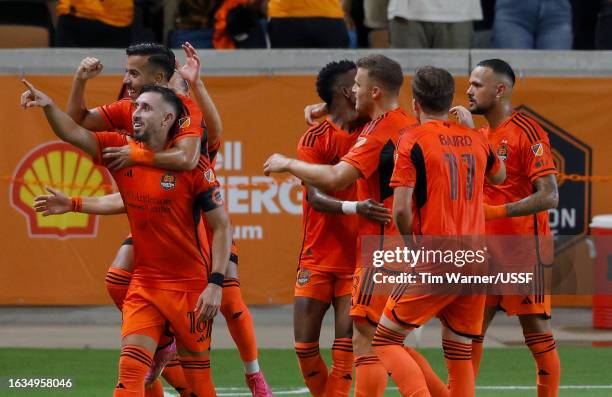 Héctor Herrera of Houston Dynamo FC celebrates with teammates after scoring a goal in the first half during the U.S. Open Cup semifinal match between...