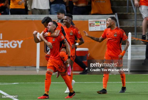 Héctor Herrera of Houston Dynamo FC celebrates with teammates after scoring a goal in the first half during the U.S. Open Cup semifinal match between...