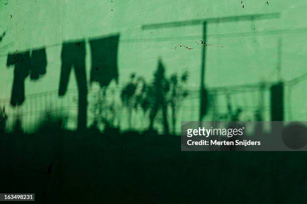 roof terrace shadow on turquoise wall - cuba sancti spíritus stock pictures, royalty-free photos & images