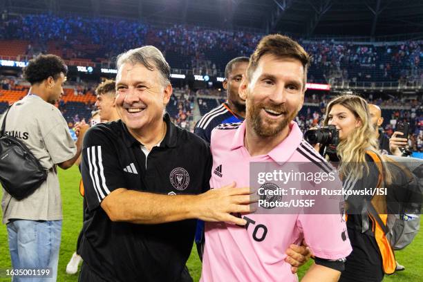 Gerardo Martino of Inter Miami and Lionel Messi of Inter Miami celebrate the win over FC Cincinnati in penalties at TQL Stadium on August 23, 2023 in...