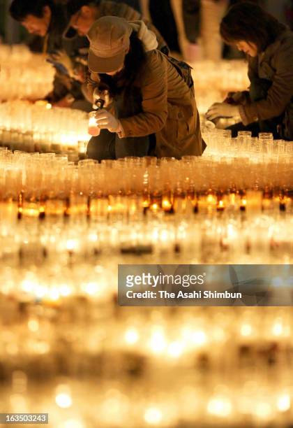 People light candles to commemorate the victims of the Magnitude 9.0 earthquake and tsunami two years ago on March 10, 2013 in Nagoya, Aichi, Japan....
