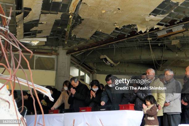 People pray for the victims during a memorial ceremony at Okawa Elementary School on March 10, 2013 in Ishinomaki, Miyagi, Japan. On March 11, Japan...