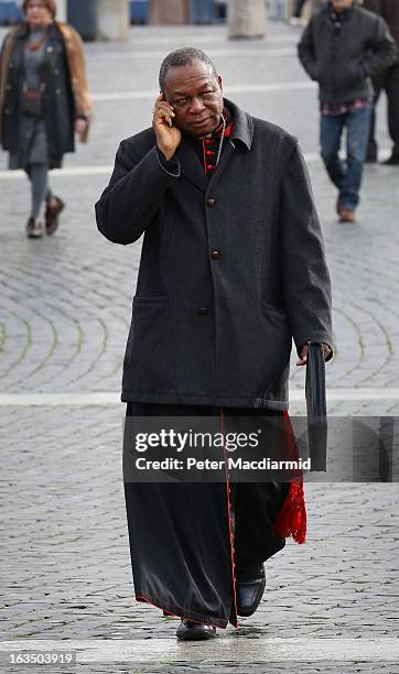 Nigerian Cardinal John Olorunfemi Onaiyekan walks through St Peter's Square on his way to the Final General Congregation on March 11, 2013 in Vatican...