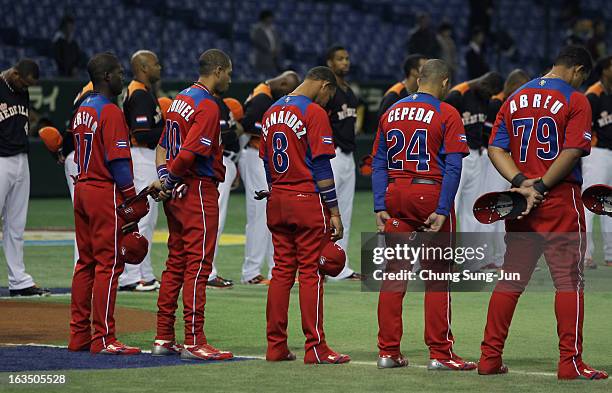 Guillermo Heredia, Yulieski Gourriel, Jose Fernandez, Frederich Cepeda, Jose Abreu and Netherlands players pay silent tribute to mark Japan's second...