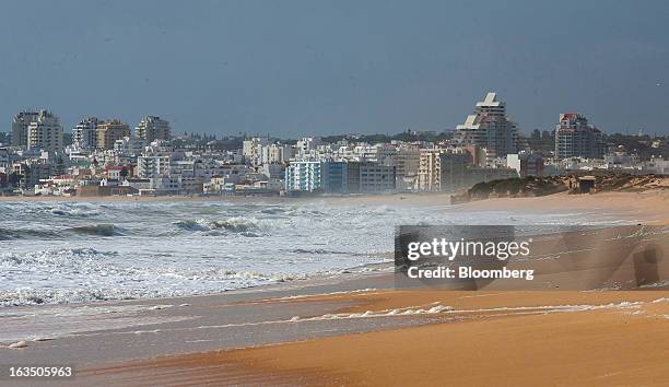 The town of Armacao de Pera stands on the Atlantic coast near a beach seen from the closed Herdade dos Salgados Resort of luxury apartments, operated...