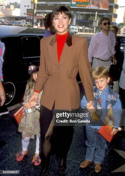 Actress Janine Turner and her niece and nephew attend the "Aladdin" Hollywood Premiere on November 8, 1992 at El Capitan Theatre in Hollywood,...