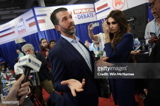 Donald Trump Jr., son of former President Donald Trump, talks to members of the media following the first debate of the GOP primary season hosted by...