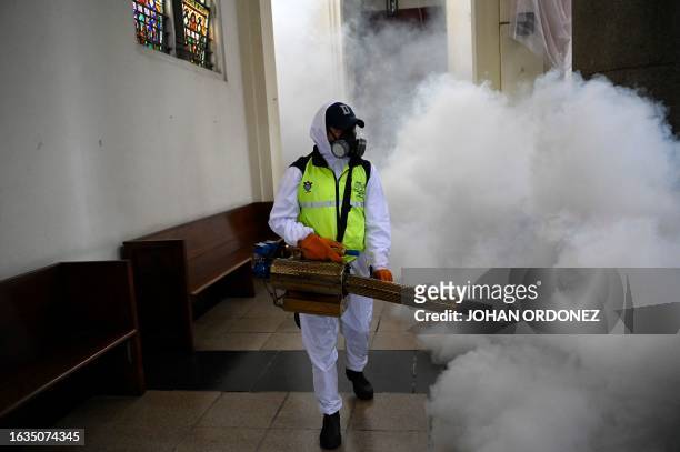 Municipal worker fumigates against the Aedes aegypti mosquito, a vector of the dengue, Zika, and Chikungunya viruses, as a preventive measure at Las...