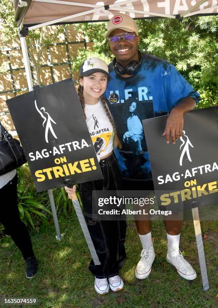 Kensington Tallman and Isaiah Crews join members and supporters of SAG-AFTRA and WGA on the picket line on August 23, 2023 in Burbank, California....