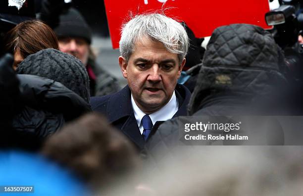 Former Liberal Democrat cabinet minister Chris Huhne arrives at Southwark Crown Court to be sentenced on March 11, 2013 in London, England. Former...