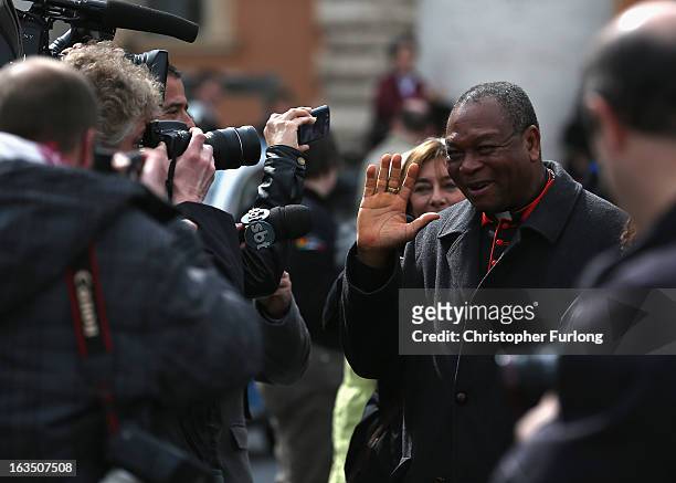 Nigerian cardinal John Onaiyekan is surrounded by media as he leaves the final congregation before cardinals enter the conclave to vote for a new...
