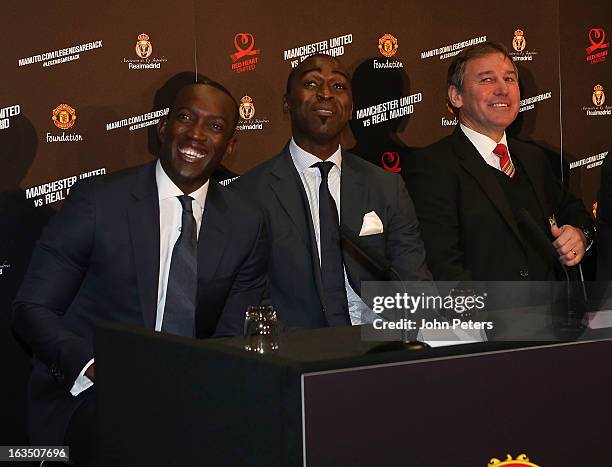 Dwight Yorke, Andrew Cole and Bryan Robson of Manchester United Legends smile at a press conference to announce a charity match between Manchester...