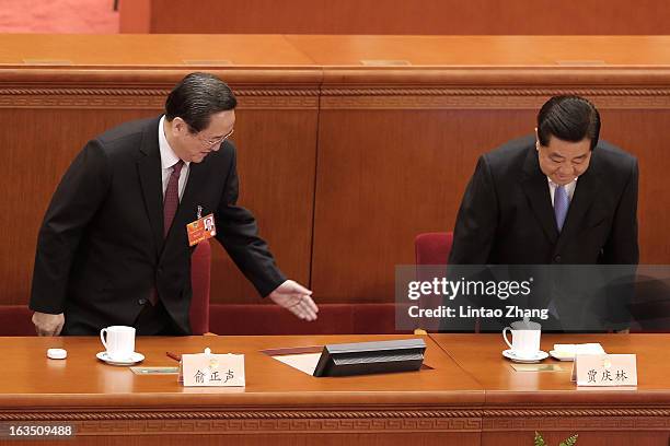 Newly-appointed Chairman of the Chinese People's Political Consultative Conference Yu Zhengsheng and outgoing Chairman Jia Qinglin attends the during...