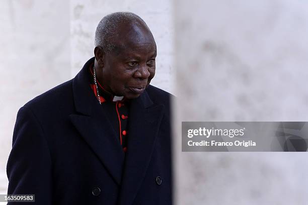 Nigerian cardinal Anthony Olubunmi Okogie leaves the final congregation before cardinals enter the conclave to vote for a new pope, on March 11, 2013...