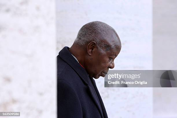 Nigerian cardinal Anthony Olubunmi Okogie leaves the final congregation before cardinals enter the conclave to vote for a new pope, on March 11, 2013...