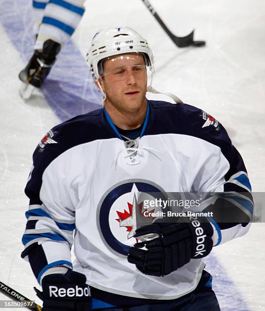 Derek Meech of the Winnipeg Jets skates against the New Jersey Devils at the Prudential Center on March 10, 2013 in Newark, New Jersey. The Devils...