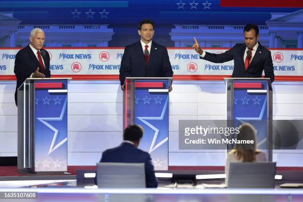Republican presidential candidates , former U.S. Vice President Mike Pence, Florida Gov. Ron DeSantis and Vivek Ramaswamy participate in the first...