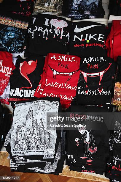 Shirts with references to Dracula are displayed at a souvenir shop at Bran Castle, famous as "Dracula's Castle," on March 10, 2013 in Bran, Romania....