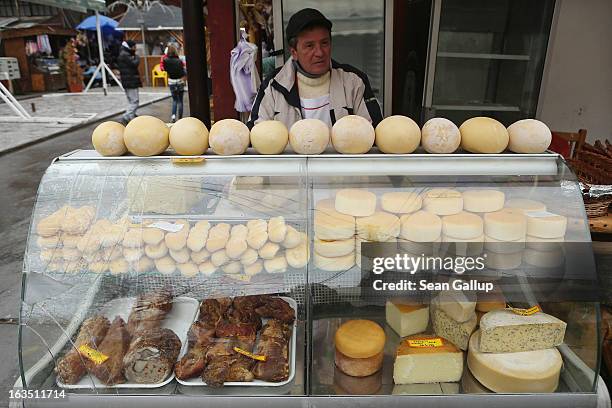 Man sells local, mountain cheese and dried meats among souvenir shops at Bran Castle, famous as "Dracula's Castle," on March 10, 2013 in Bran,...