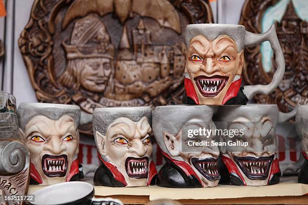 Mugs bearing a rendition of Dracula are displayed at a souvenir shop at Bran Castle, famous as "Dracula's Castle," on March 10, 2013 in Bran,...
