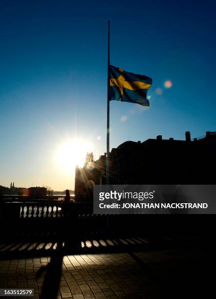 Swedish flag flies at half-mast in downtown Stockholm on March 11, 2013 in honor of Swedish Princess Lilian, who died on March 10, 2013 at the age of...